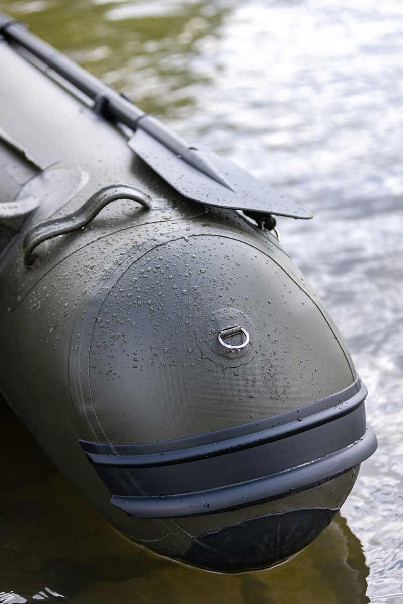 Close-up of the Barca Fox 320x Airdeck inflatable boat on water, showcasing its durable design and features.