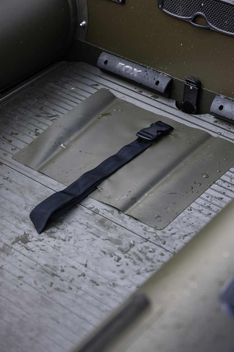 Interior view of the Barca Fox 320x Airdeck with air floor and securing strap for stability during carpfishing.